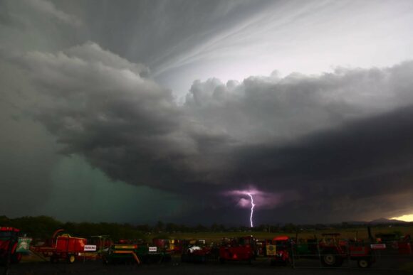 Lightning bolt illuminates wall cloud in supercell Beaudesert