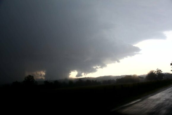 Likely wall cloud - this was reported to be a tornado or have a tornado. I have not seen evidence of a tornado personally. Trees were down in the area according to those chasers. Can it be straight line winds after the wall cloud moved on? I have not seen doppler for this event or this specific stage.