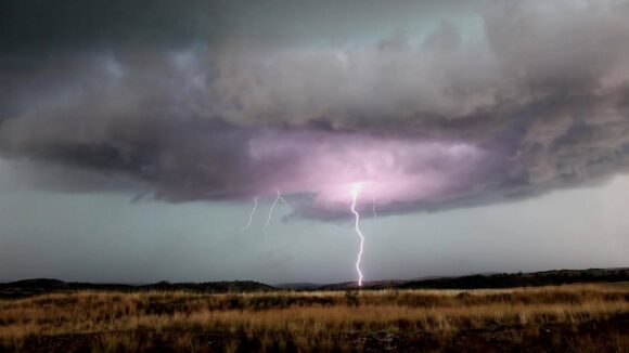 Lightning hitting the nearby hills